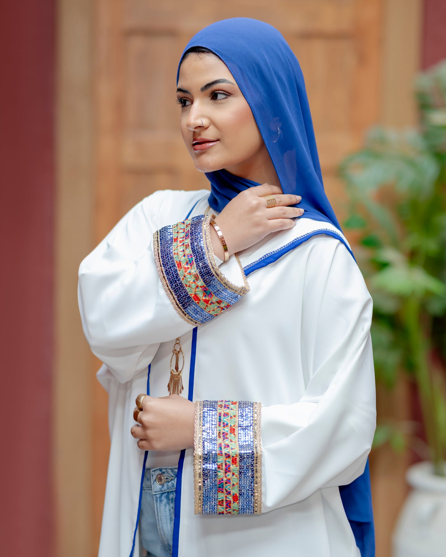 Elegant White Abaya with Blue Embroidered Sleeves